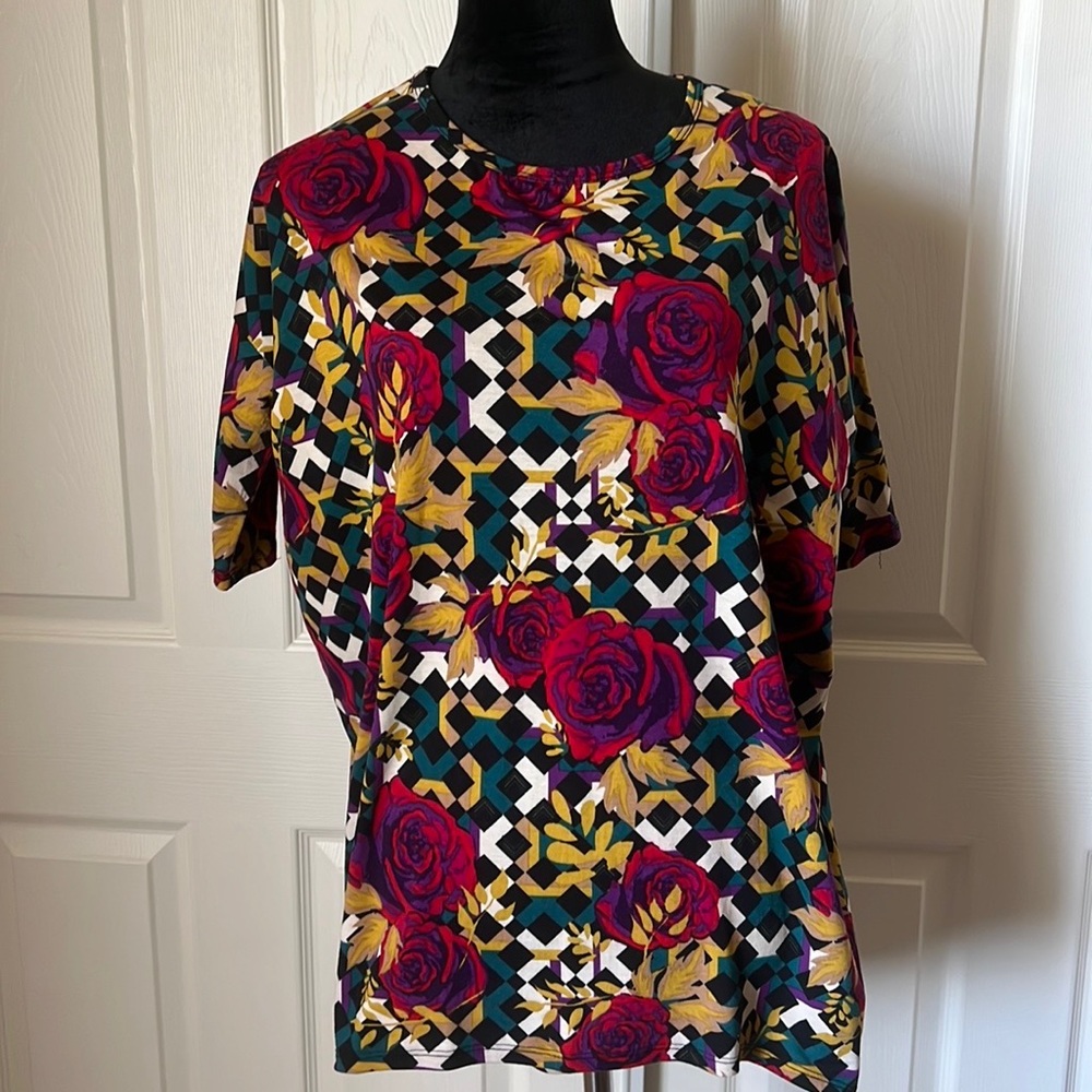 LuLaRoe Multicolored Rose print Irma with black and white checkered background.